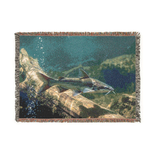 Catfish swimming over log Woven Blanket